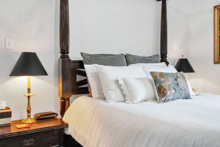 Plush bed dressed in crisp layers for total comfort.
