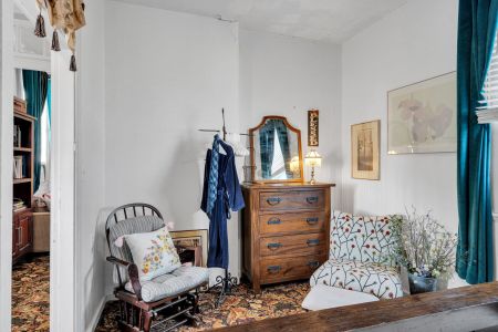 Eclectic bedroom full of local personality & one-of-a-kind charm.

