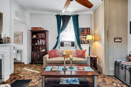 Bright, cozy living room full of classic NOLA charm.
